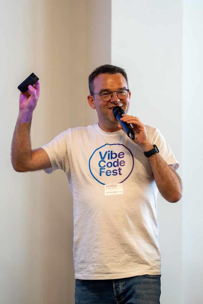 A mentor presenting vibe coding tips on stage